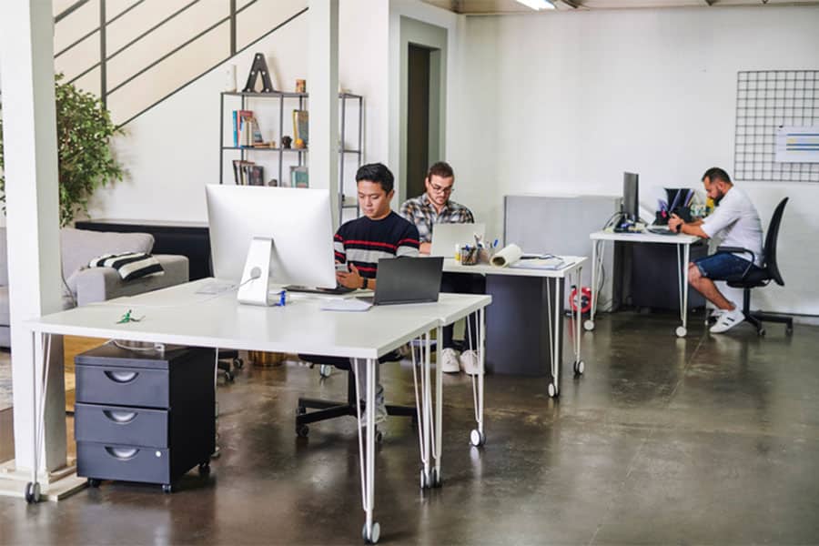 Men Sitting At Computers