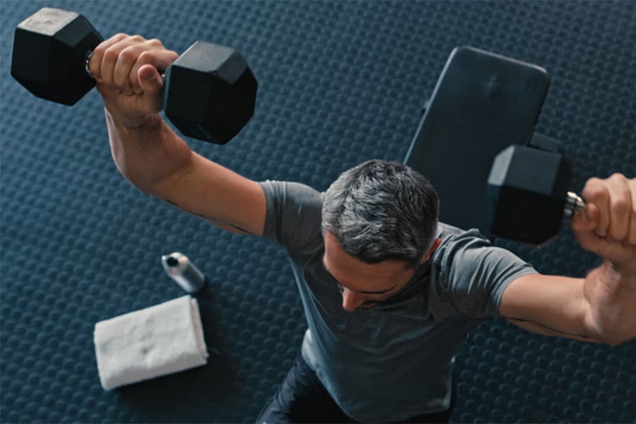 Man Doing Shoulder Press with Weights