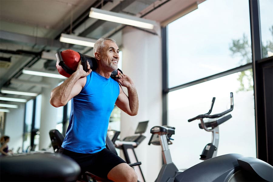 Man Squatting with Weight on Back